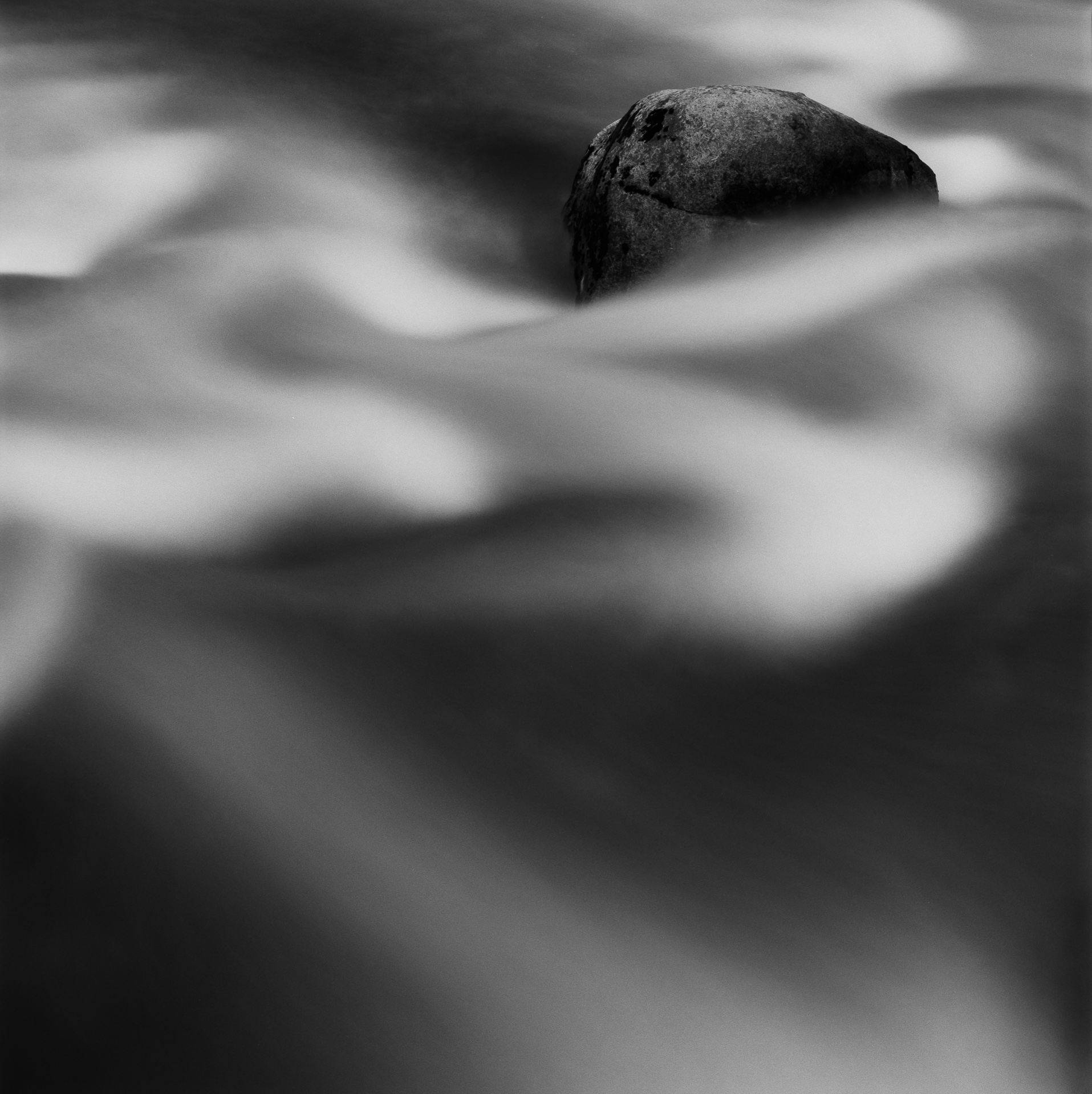 Stationary Rock in flowing water